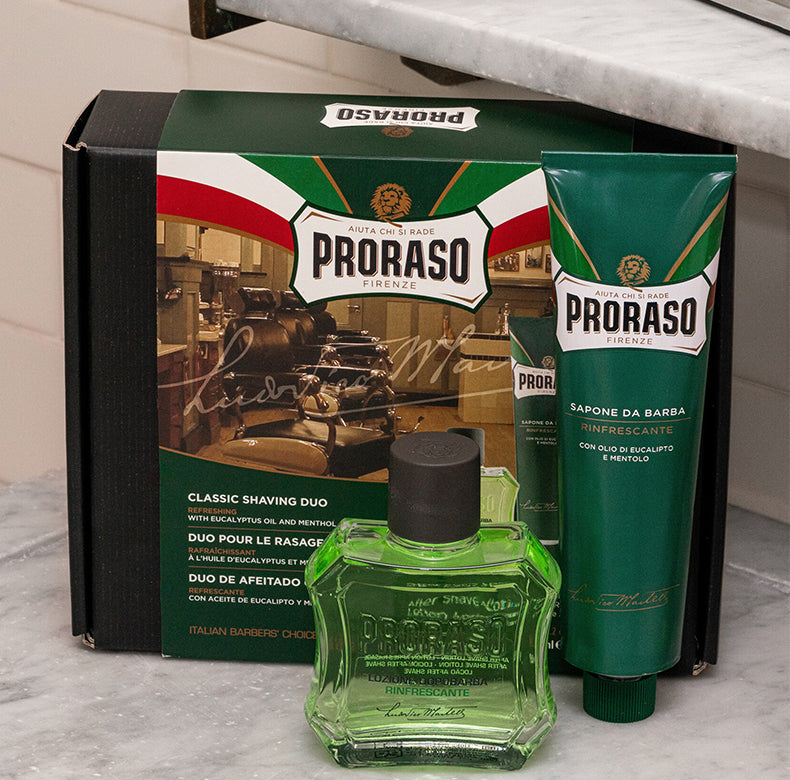 Refresh formula Classic Shaving Duo box packaging sitting on white bathroom marble counter with After Shave Lotion bottle and Shave Cream Tube sitting in front of box