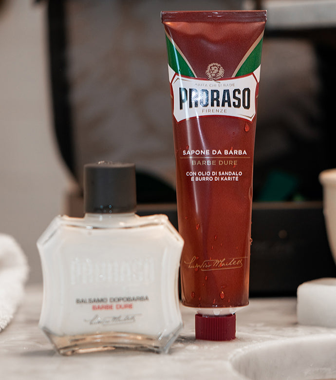 Proraso Nourishing for Coarse Beards After Shave Balm and Proraso Nourishing for Coarse Beards Shave Cream Tube on bathroom counter.