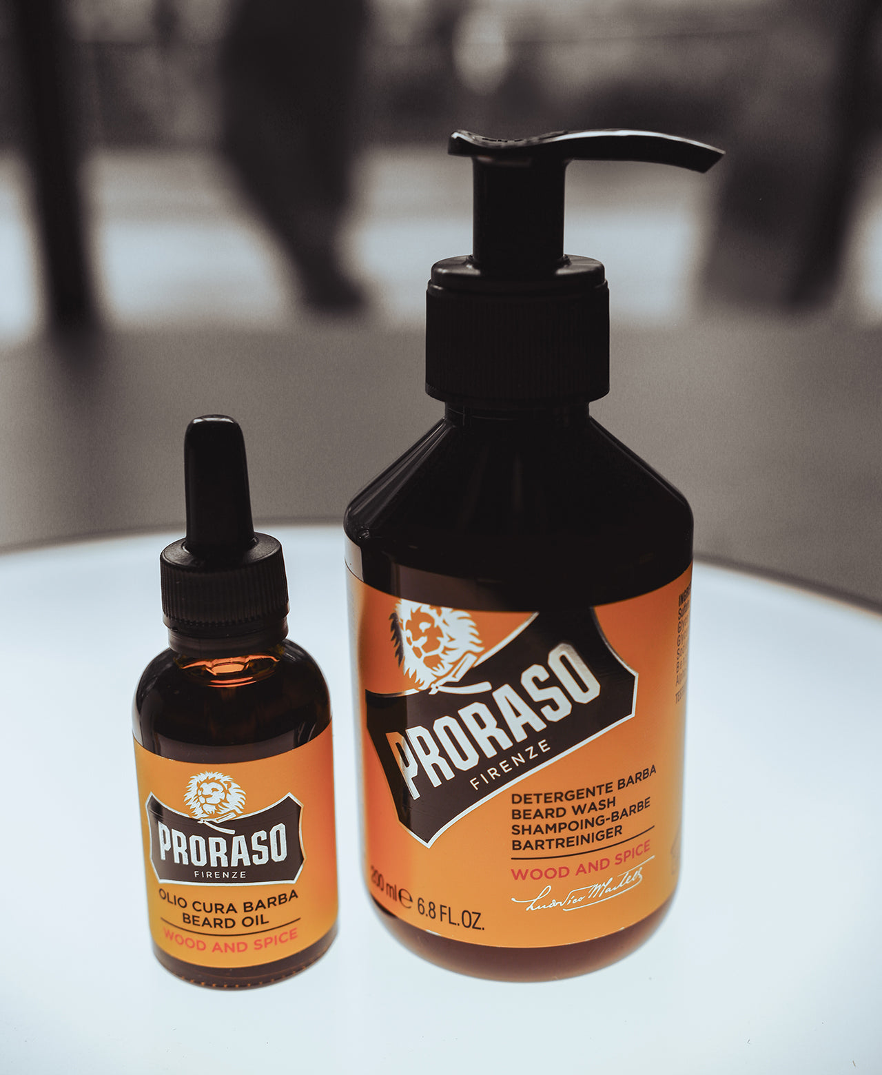 Wood & Spice Beard Oil and Beard Wash sitting on a white table with high contrast background