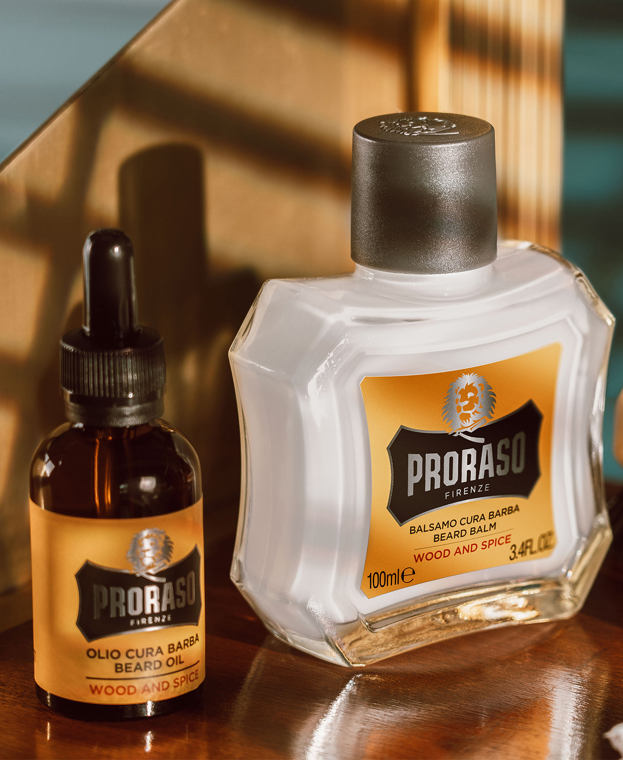 Bottle of Wood & Spice Beard Oil and Wood & Spice Beard Balm sitting on a wood shelf 