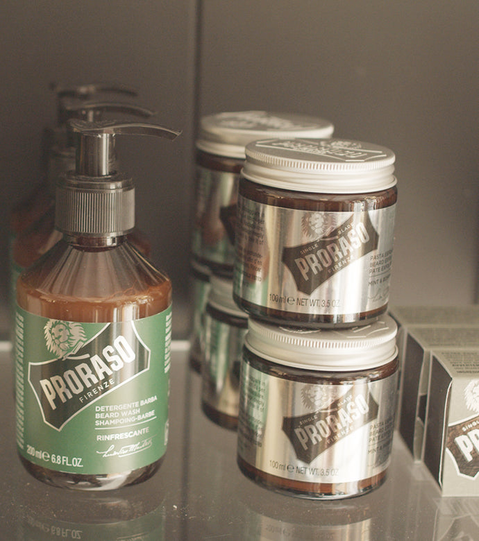 Refreshing Beard Wash and Exfoliating Beard Paste and Facial Scrub on retail shelf in a barbershop 