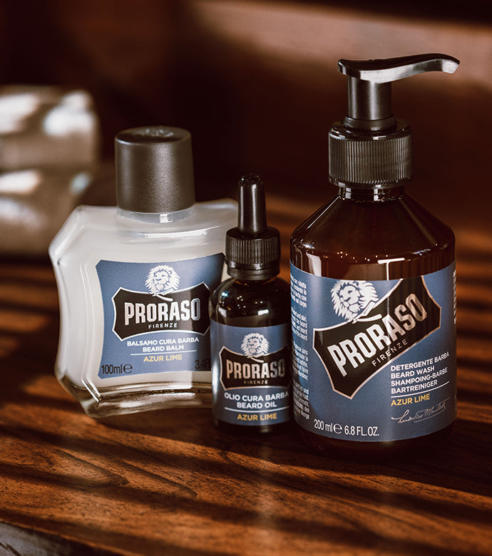 From left to right: Azur Lime Lime Beard Balm, Beard Oil and Beard Wash on a brown wooden table