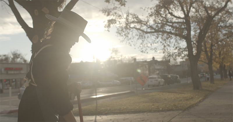 Dani sweeping in front of her barbershop