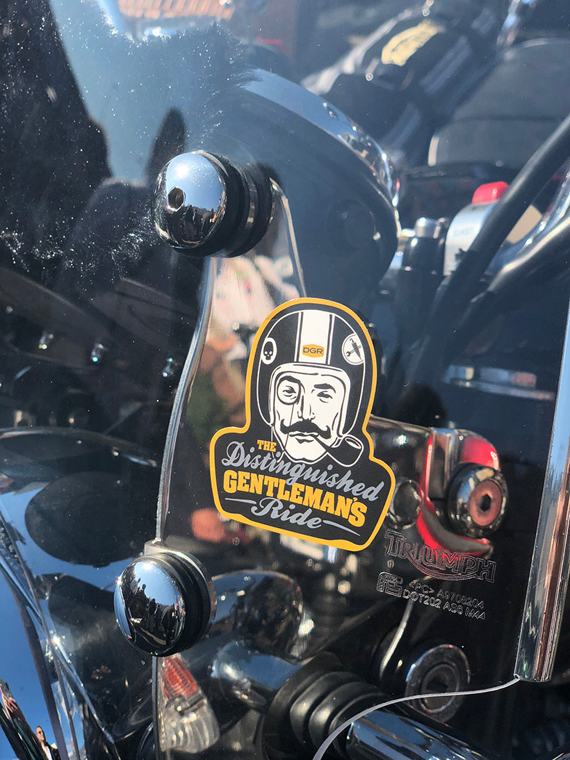 The Distinguished Gentleman's Ride sticker on a vintage motorcycle