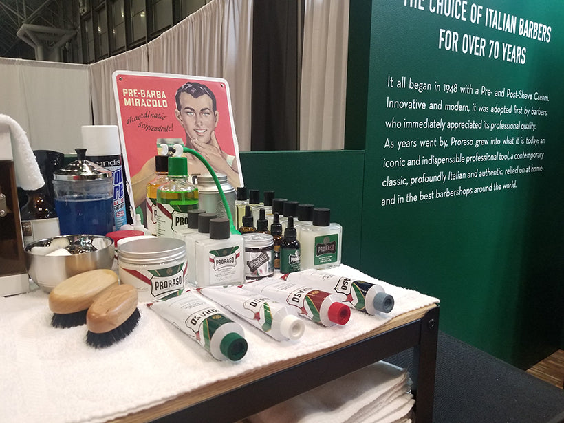 Proraso set up at the tradeshow, various products set out for a barber to use during a shave.