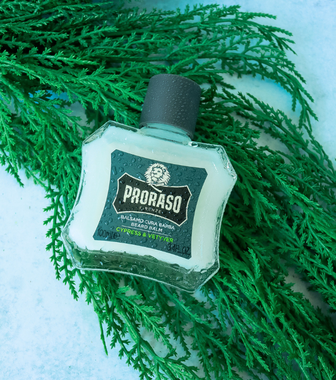 Bottle of Cypress & Vetyver Balm sitting on Cypress branch 