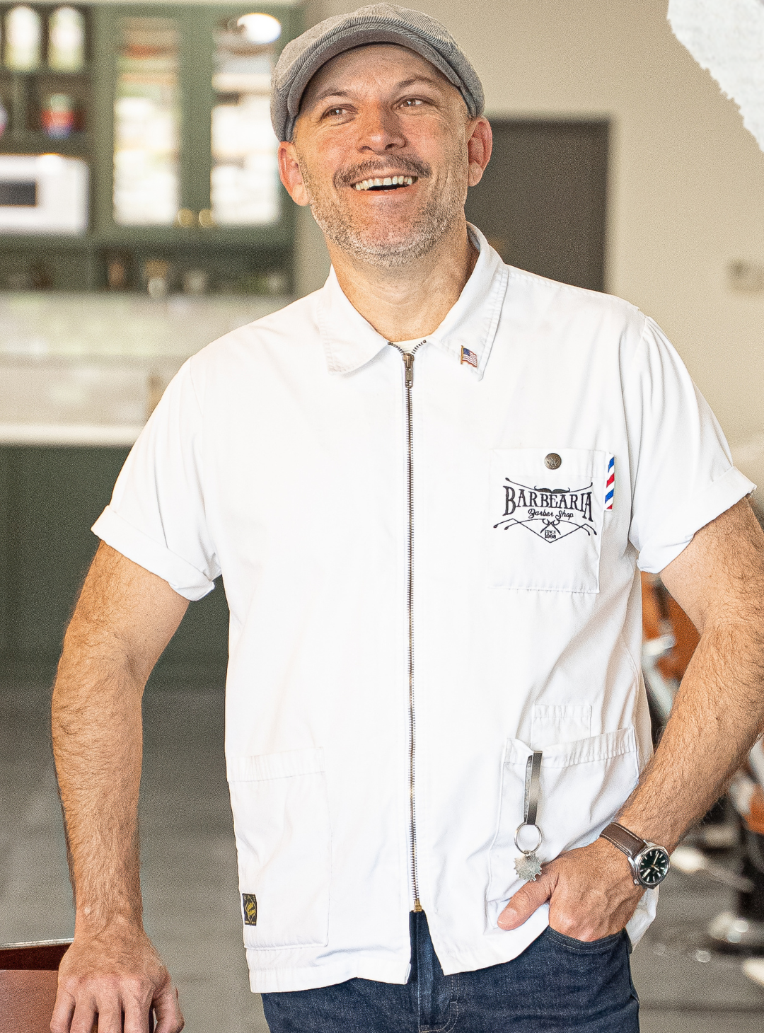 Barber Fabiano standing in his barber shop