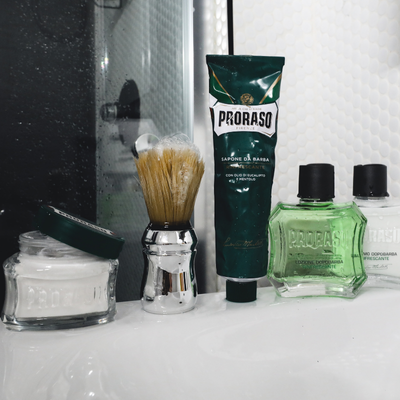 Image of Refreshing Shave lineup on a bathroom counter: Pre-Shave Cream, Shave Cream Tube, After Shave Lotion and After Shave Balm