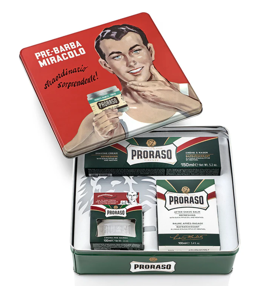 Image of Vintage Gino tin with lid off to show products in box- Refreshing Pre-Shave Cream, Shave Cream Tube and After Shave Balm on a white background
