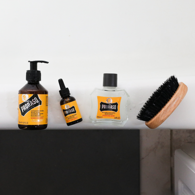 Wood & Spice Beard Lineup on edge of bathtub Beard Wash, Beard Oil, Beard Balm and Old Style Military Brush